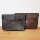 The superior labor / Leather clutch bag